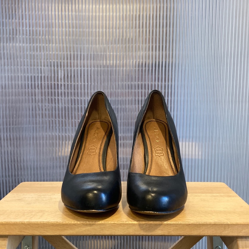 Aldo brand black leather pump heels.
